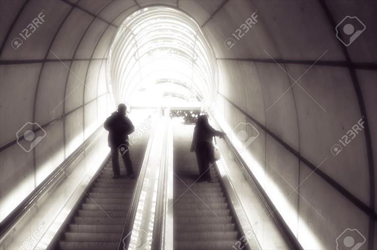 Architektura,Schody, Staircase - 5760683-people-in-tunnel-staircase-into-the-light-in-Bilbao-in-spain-Stock-Photo.jpg